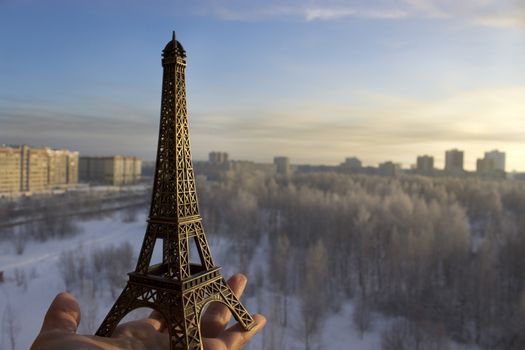 miniature of Tour Eiffel in Paris in hand