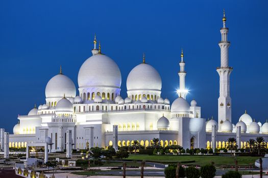 View of famous Abu Dhabi Sheikh Zayed Mosque by night, UAE.