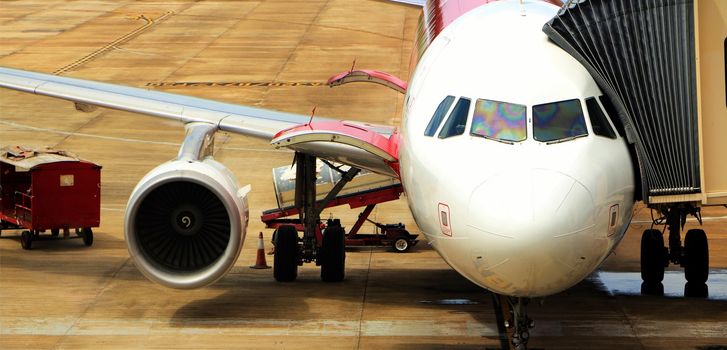 Airplane on the ground boarding for departure