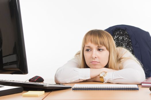 young beautiful business woman sitting at office desk working, isolated on white background