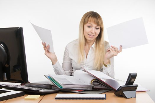 young beautiful business woman sitting at office desk working, isolated on white background