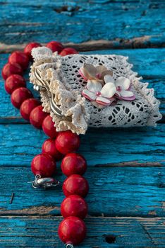 coral beads strewn with autumn leaves