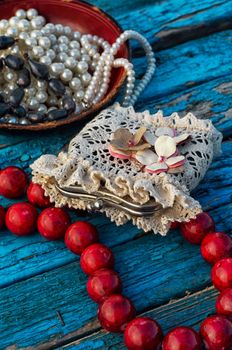 coral beads strewn with autumn leaves