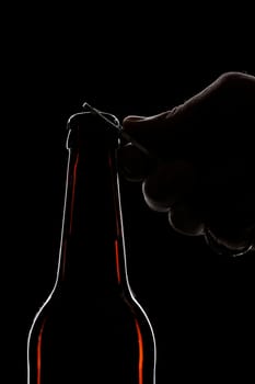 beer bottle open close up with hand black 