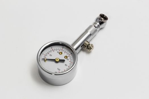 Tire pressure gauge isolated on white background