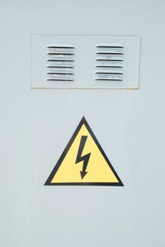 Yellow electric emergency sign with gray background