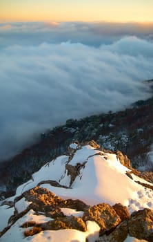 Sunset on snow-covered mountains.