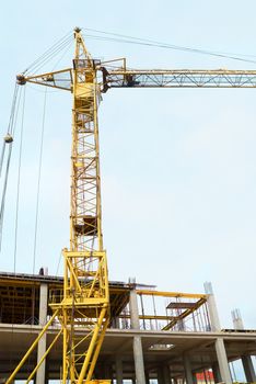 Building crane with the blue sky background