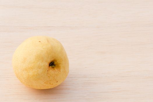 Asian pear on wood background