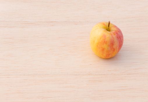 fuji apple on wood background