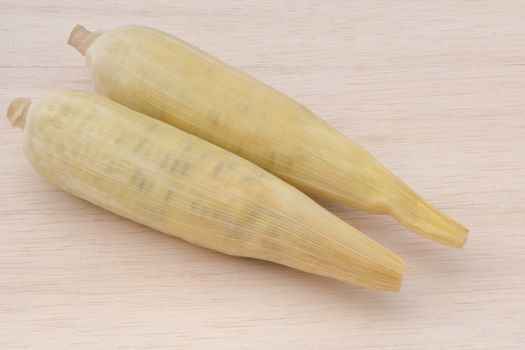 waxy corn,waxy maize on wood background