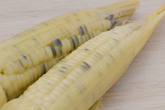 waxy corn,waxy maize on wood background