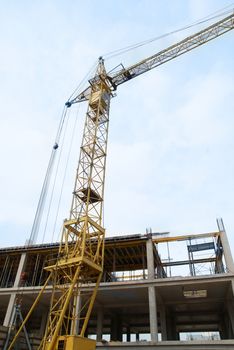 Building crane with the blue sky background