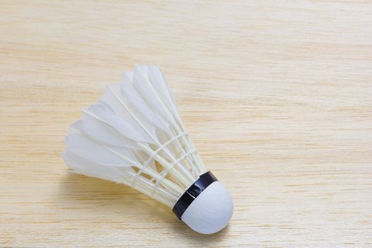 shuttlecock on wood background