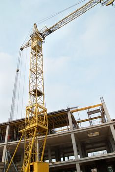 Building crane with the blue sky background