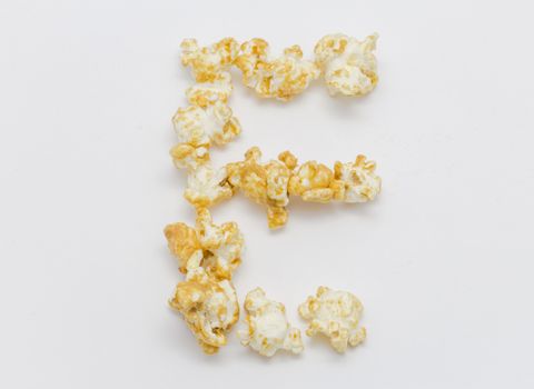 pop corn forming letter E isolated on white background