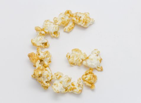 pop corn forming letter G isolated on white background