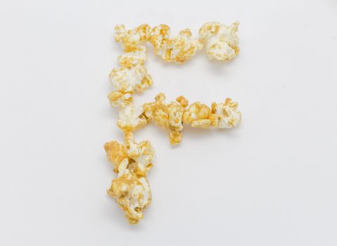 pop corn forming letter F isolated on white background