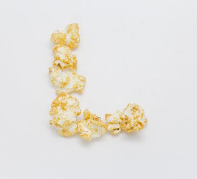 pop corn forming letter L isolated on white background