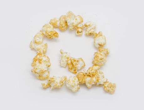 pop corn forming letter Q isolated on white background