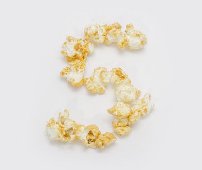 pop corn forming letter S isolated on white background