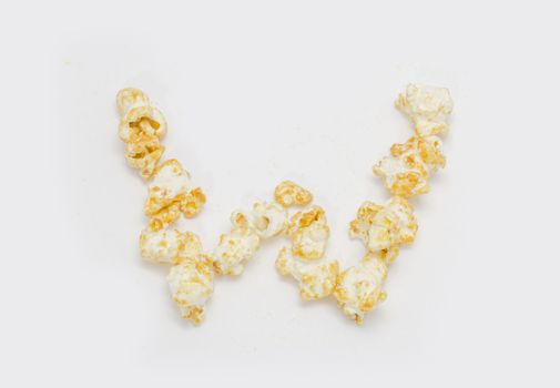pop corn forming letter W isolated on white background