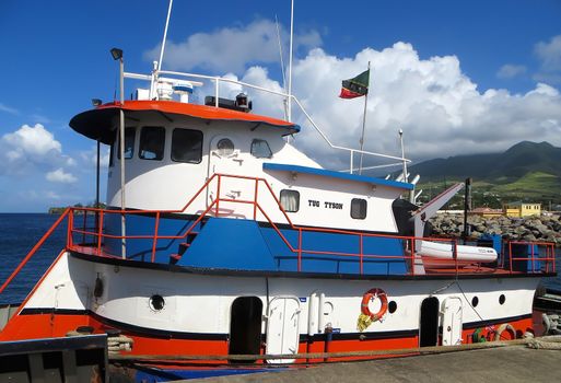 Basseterre, Saint Kitts and Nevis- June 21, 2013:Tugboat tied to its mooring on the dock awaits a call for action on this small Caribbean island.