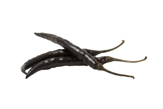 dried black chili peppers on white background