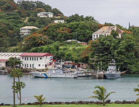 Castries City, Saint Lucia- June 20, 2013: Police boats sit at the ready in the harbor awaiting patrol on this small island in the Caribbean.