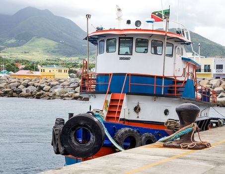 Basseterre, Saint Kitts and Nevis- June 21, 2013:Tugboat tied to its mooring on the dock awaits a call for action on this small Caribbean island.
