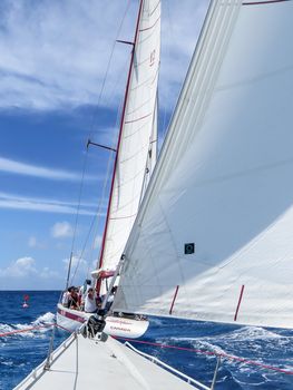 Great Bay, St. Maarten, Netherlands Antilles-June 22, 2013: Former America's Cup yacht, Canada 2, picks up wind and gives the the tourists and crew a thrilling cruise off the coast.