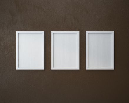 3 Blank frame on  brown wall.