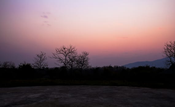 Twilight foggy sunset sky background