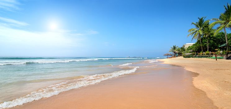 Waves of the ocean on sandy beach