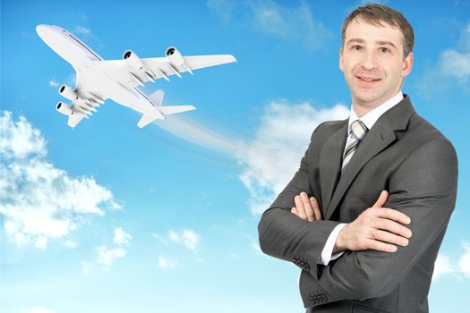 Smilimg businessman looking at camera with jet