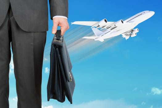 Businessman with suitcase and jet on blue sky