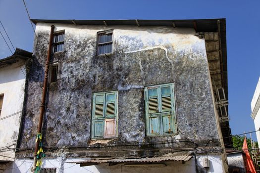 Old wooden windows at Stone Town the capital of Zanzibar island East Africa. Zanzibar