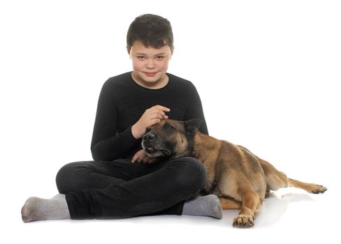 young teen and malinois in front of white background