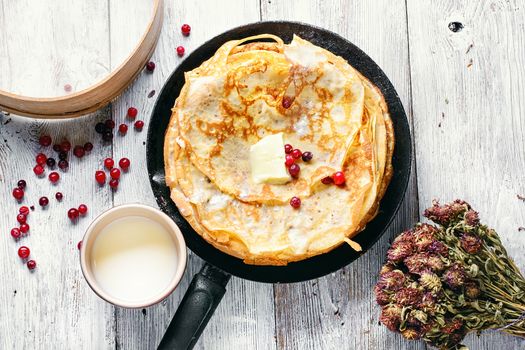 Freshly baked pancakes on a light background for the holiday carnival.Top view