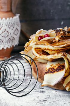 Freshly baked pancakes on light background for the holiday carnival