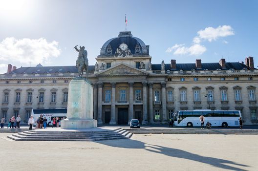 Paris, France - May 15, 2015: People around Institute for Higher National Defence Studies(IHEDN) in Paris. IHEDN near the Champs de Mars, at the foot of the Eiffel Tower in Paris.