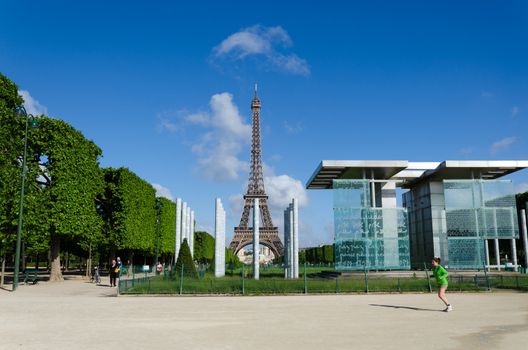 Paris, France - May 15, 2015: People around The Wall for Peace on the Champs de Mars, at the foot of the Eiffel Tower in Paris. The Wall for Peace is freely inspired by the Wailing Wall of Jerusalem.