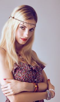 Hippie boho woman sensually looks. Beauty young playful positive blonde, long hair, ethnic accessories relax. Floral sundress, romantic style.Attractive loving girl. Unusual creative, people,copyspace