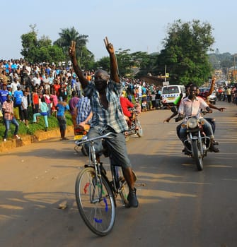UGANDA, Entebbe: Supporters of Kizza Besigye, Uganda's leading opposition leader and presidential candidate, show support after an election rally in Entebbe, Uganda, on February 11, 2016. Besigye will challenge incumbent President Yoweri Museveni for the fourth time when voters go to the polls on February 18, 2016.