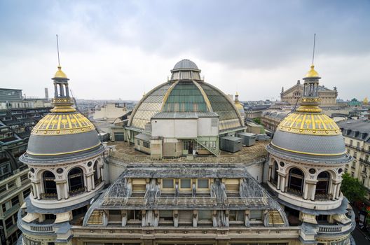 Paris, France - May 15, 2015: Rooftop of Printemps in Paris, France. The largest beauty Department Store in the world with 45000 square meters of shopping. Printemps facade (registered as Historic Monument).