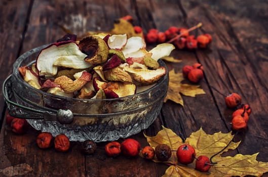 Autumn still life with dried apples in a rustic style.