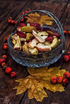 Autumn still life with dried apples in a rustic style.