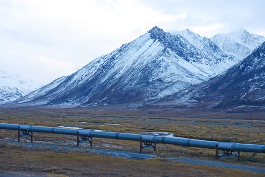 oil pipeline with mountain in northern alaska