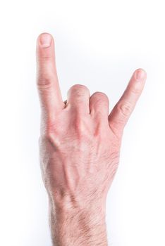 Man's hand miming horns on white background