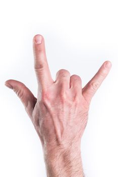 Man's hand miming horns on white background